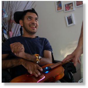 Picture of a man with a modified violin